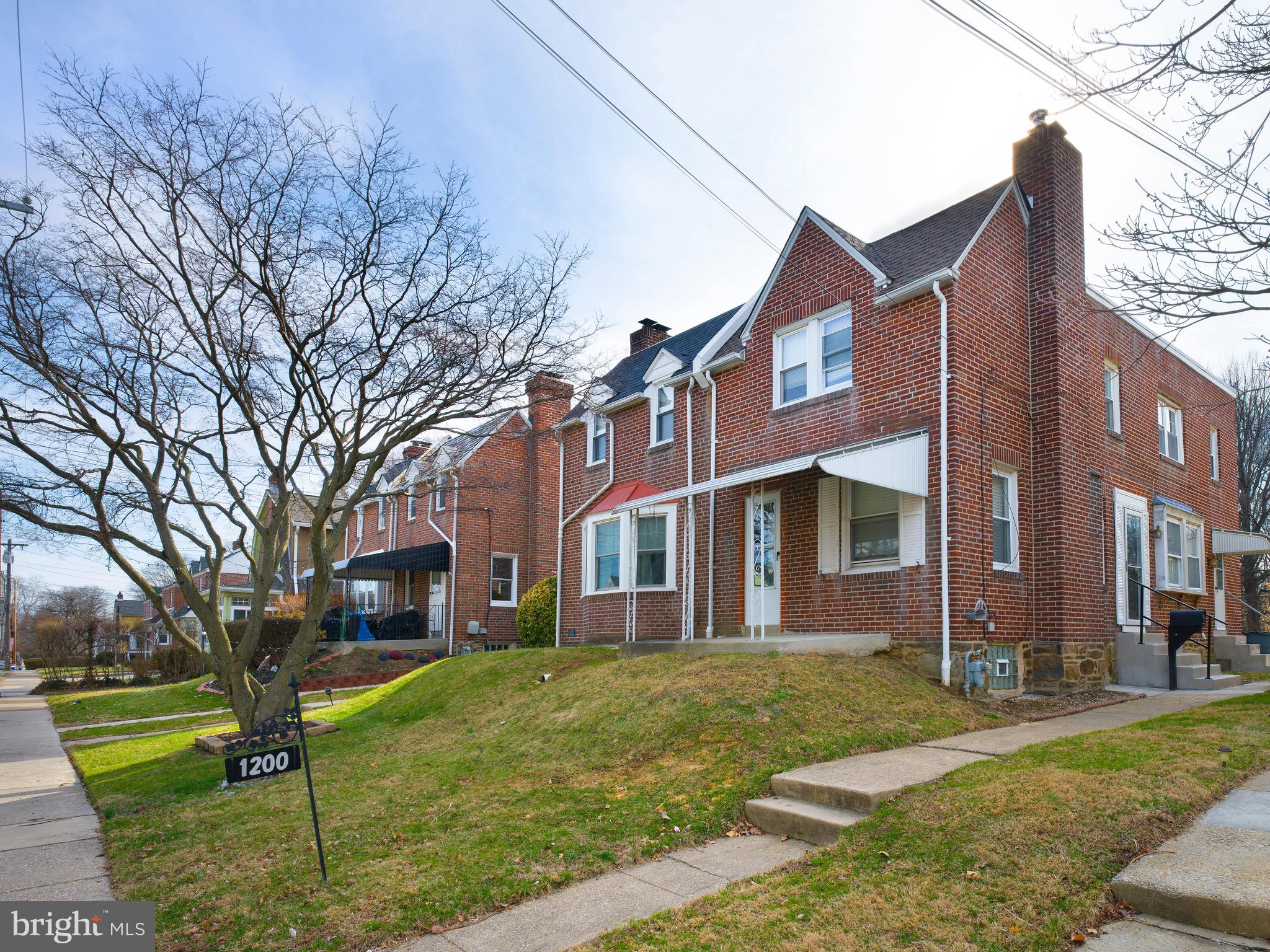 1200 Angora Avenue Lansdowne, PA 19050 - Photo 1 of 20 a front view of a residential apartment building with a yard