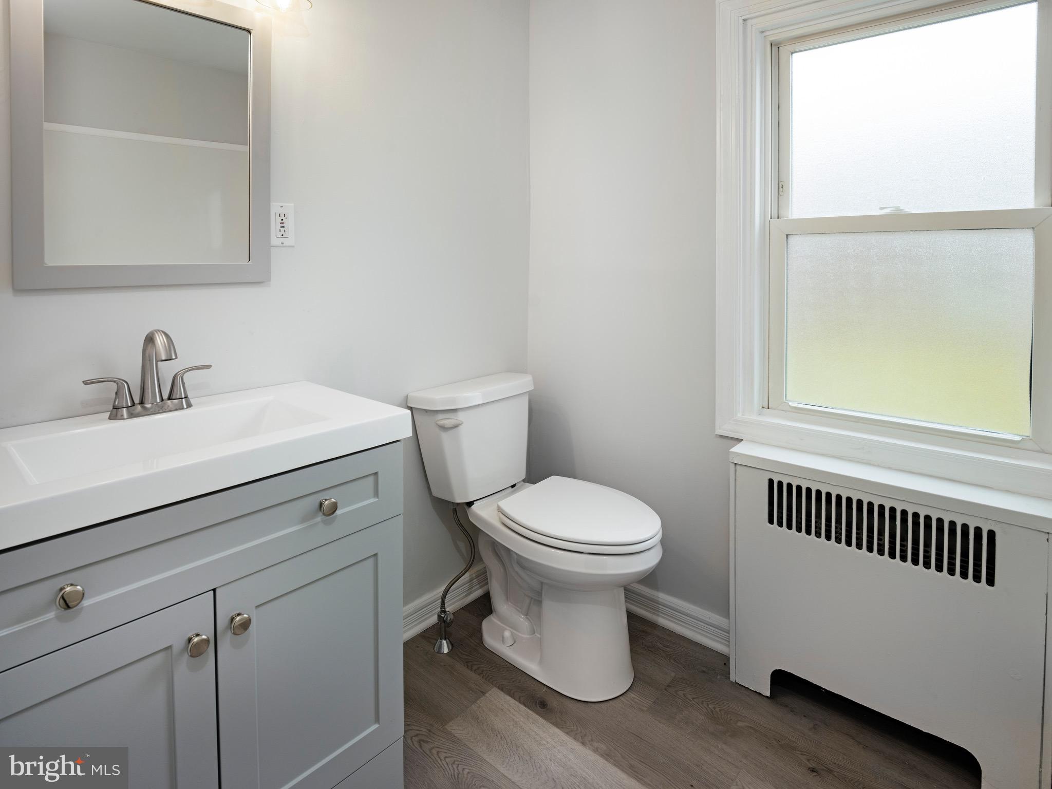 1200 Angora Avenue Lansdowne, PA 19050 - Photo 11 of 20 a bathroom with a toilet a sink and a window
