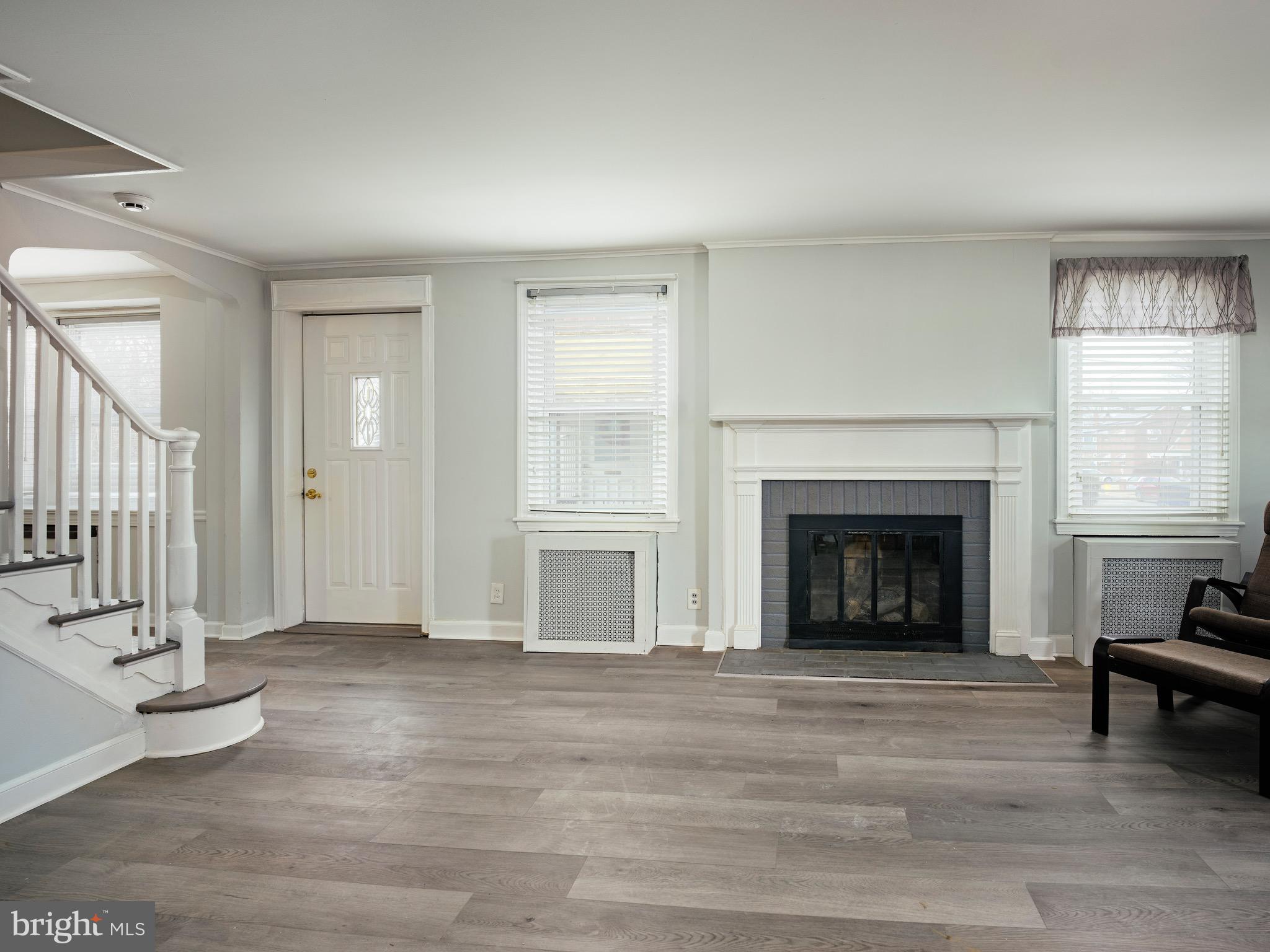 1200 Angora Avenue Lansdowne, PA 19050 - Photo 8 of 20 a view of a livingroom with a fireplace and window