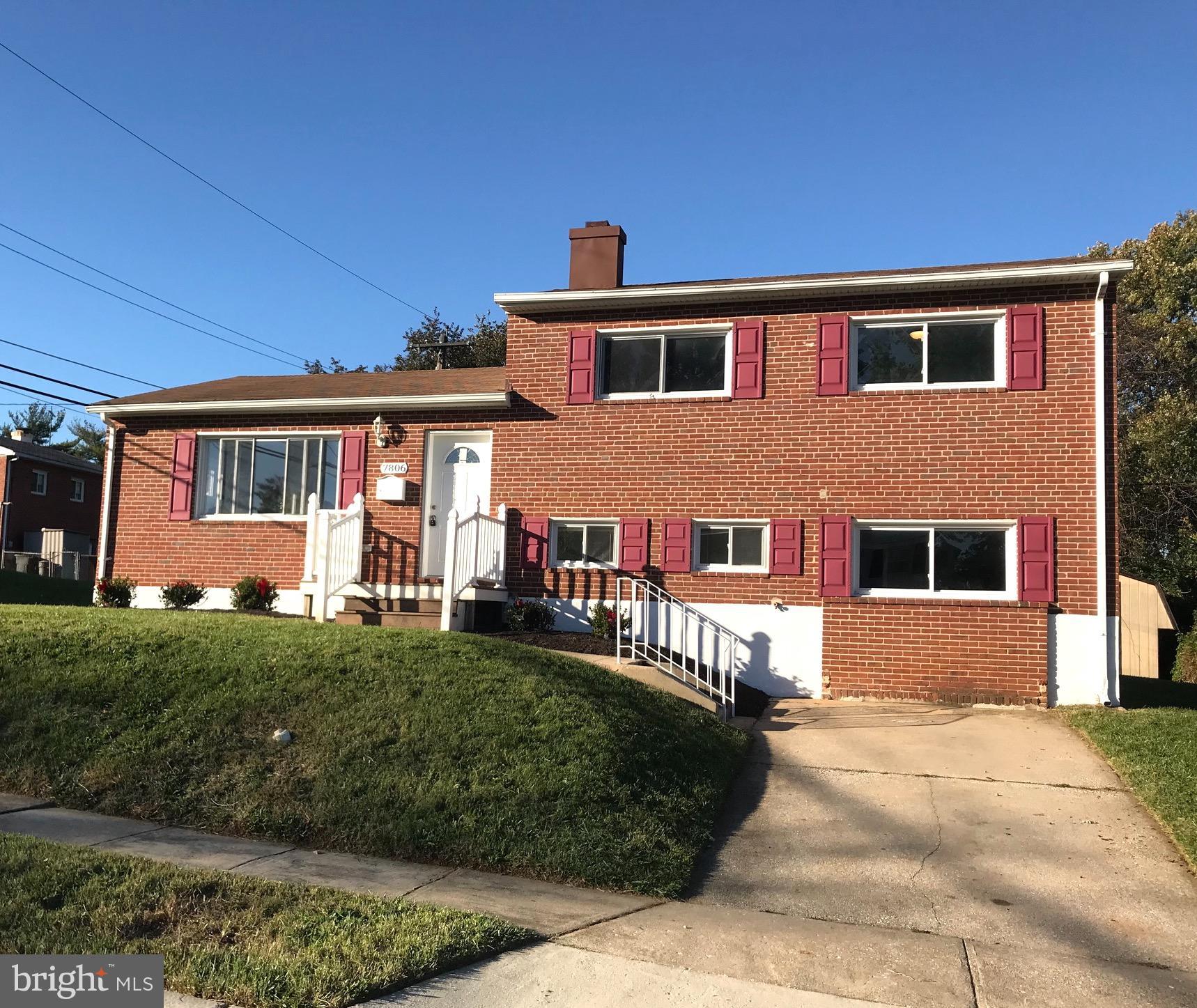 7806 Selgrave Road Baltimore, MD 21244 - Photo 1 of 25 a front view of a house with a yard