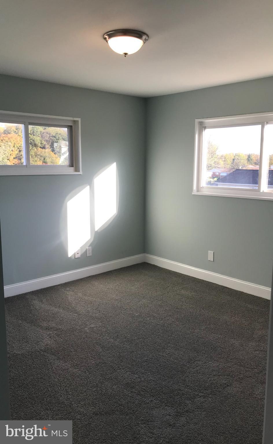7806 Selgrave Road Baltimore, MD 21244 - Photo 17 of 25 an empty room with windows