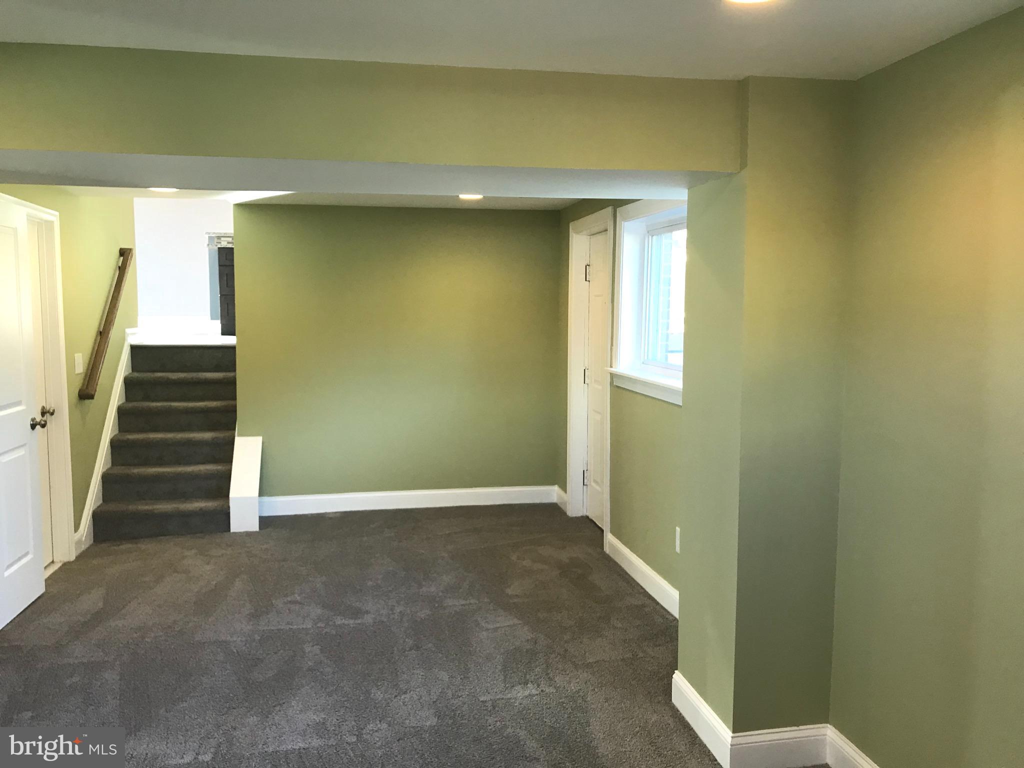 7806 Selgrave Road Baltimore, MD 21244 - Photo 23 of 25 a view of an empty room with stairs