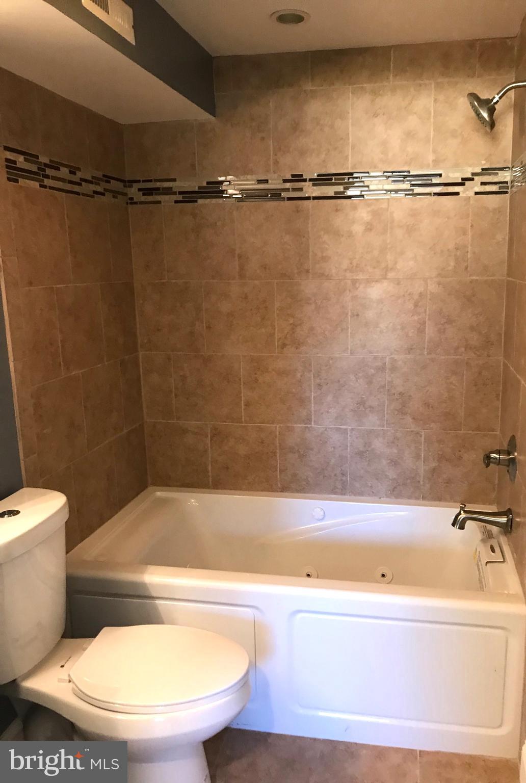 7806 Selgrave Road Baltimore, MD 21244 - Photo 25 of 25 a view of a bathtub in a bathroom