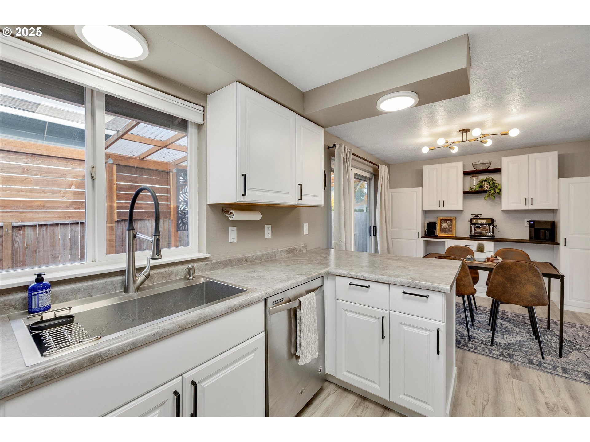 2389 F Street Hubbard, OR 97032 - Photo 12 of 34 a kitchen with a sink cabinets and window