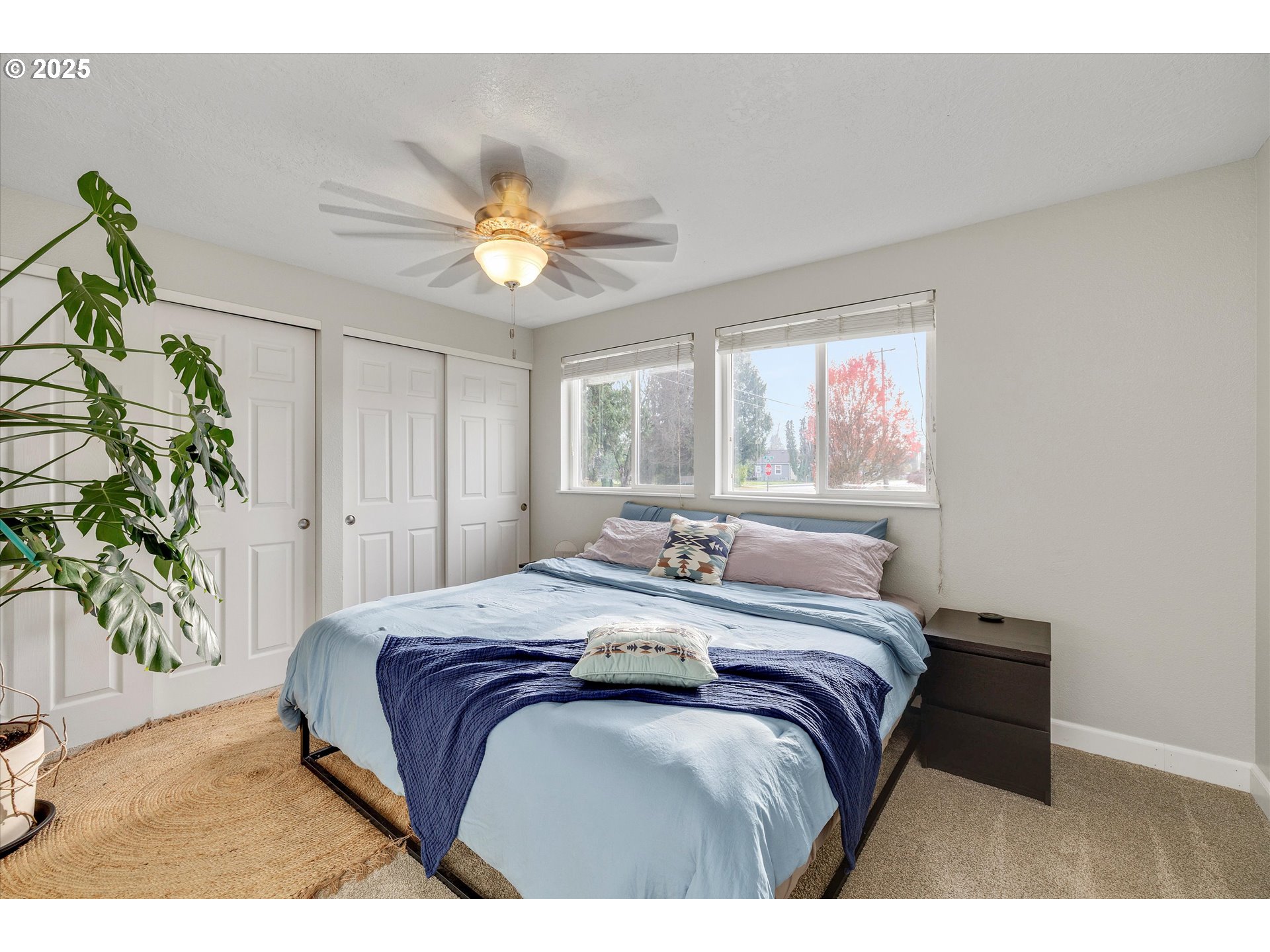 2389 F Street Hubbard, OR 97032 - Photo 13 of 34 a bedroom with a bed and a chandelier
