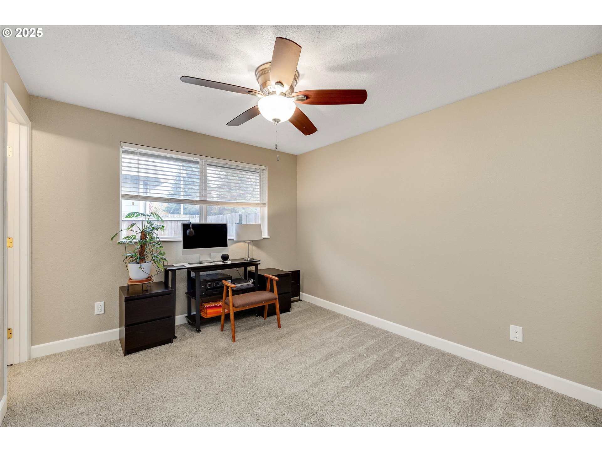 2389 F Street Hubbard, OR 97032 - Photo 17 of 34 a view of a workspace with furniture and a window