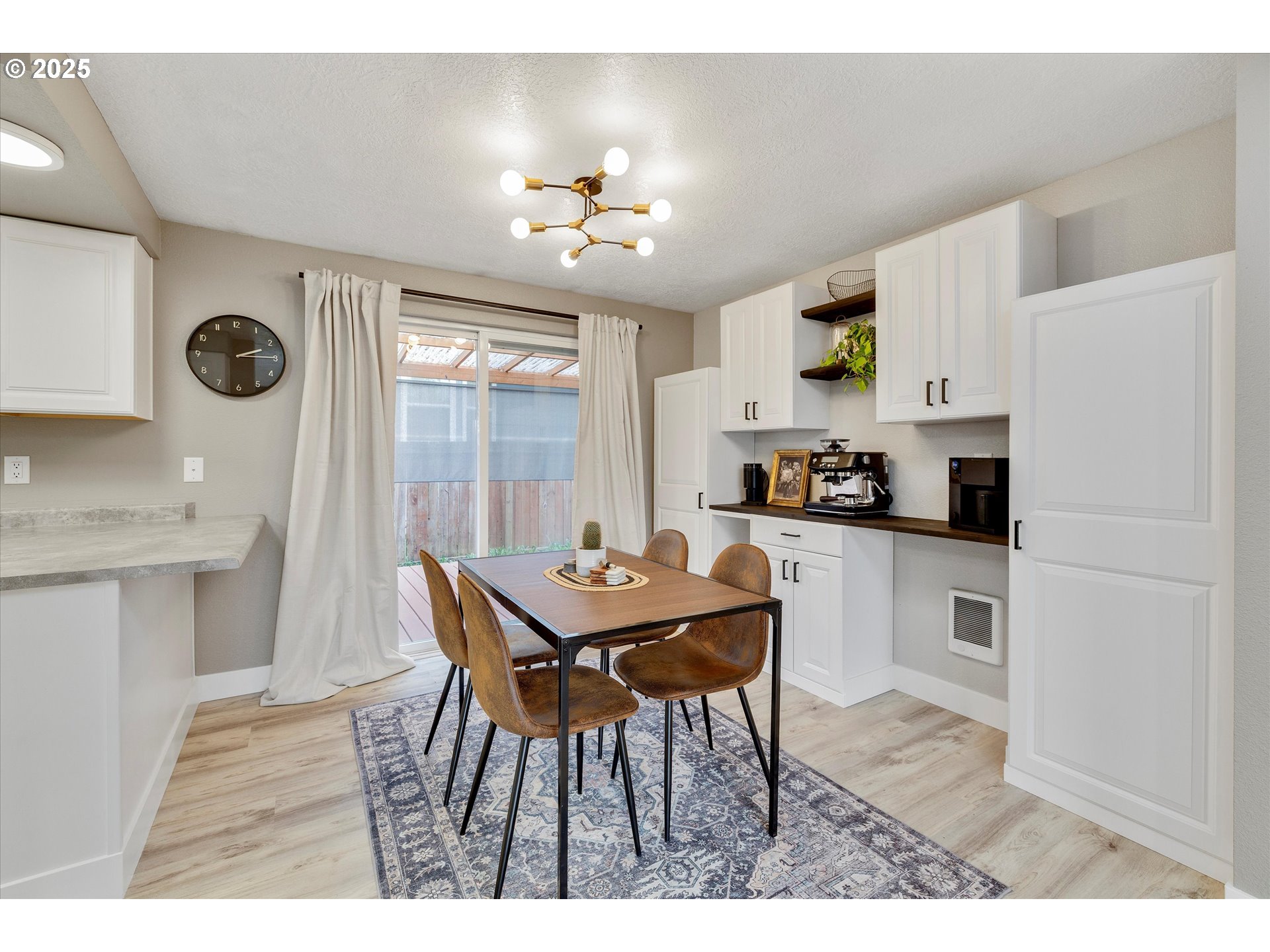 2389 F Street Hubbard, OR 97032 - Photo 7 of 34 a kitchen with kitchen island granite countertop a sink cabinets and refrigerator