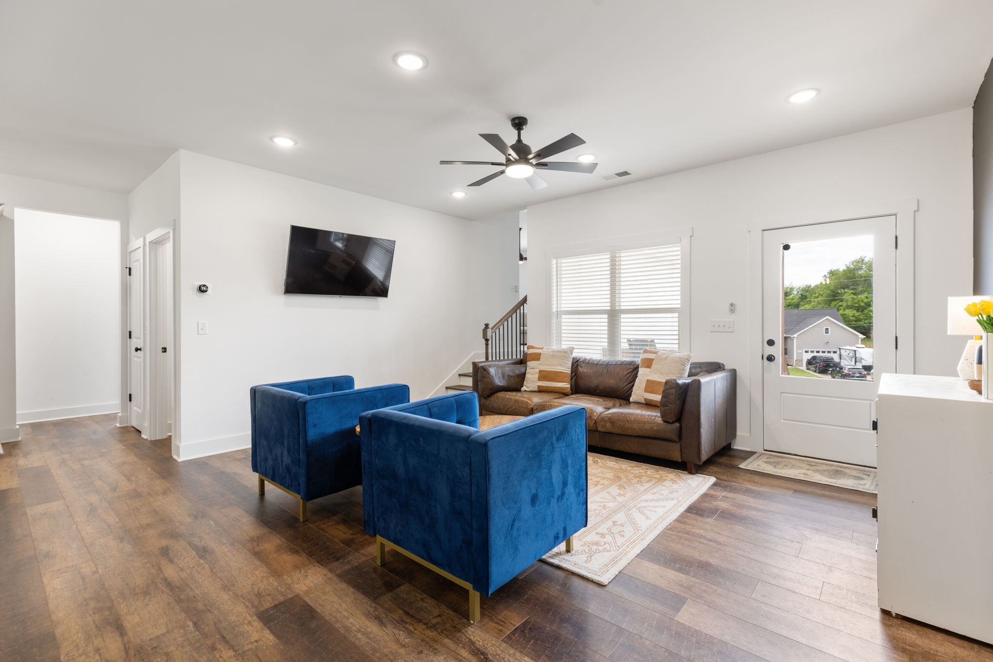 1578 Angus Way Greenbrier, TN 37073 - Photo 9 of 45 a living room with furniture a flat screen tv and a large window