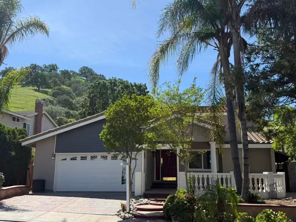 a view of a house with a street