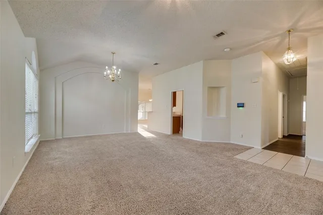 a view of an empty room with a bathroom