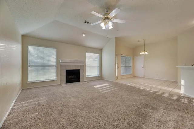 a view of an empty room with a fireplace