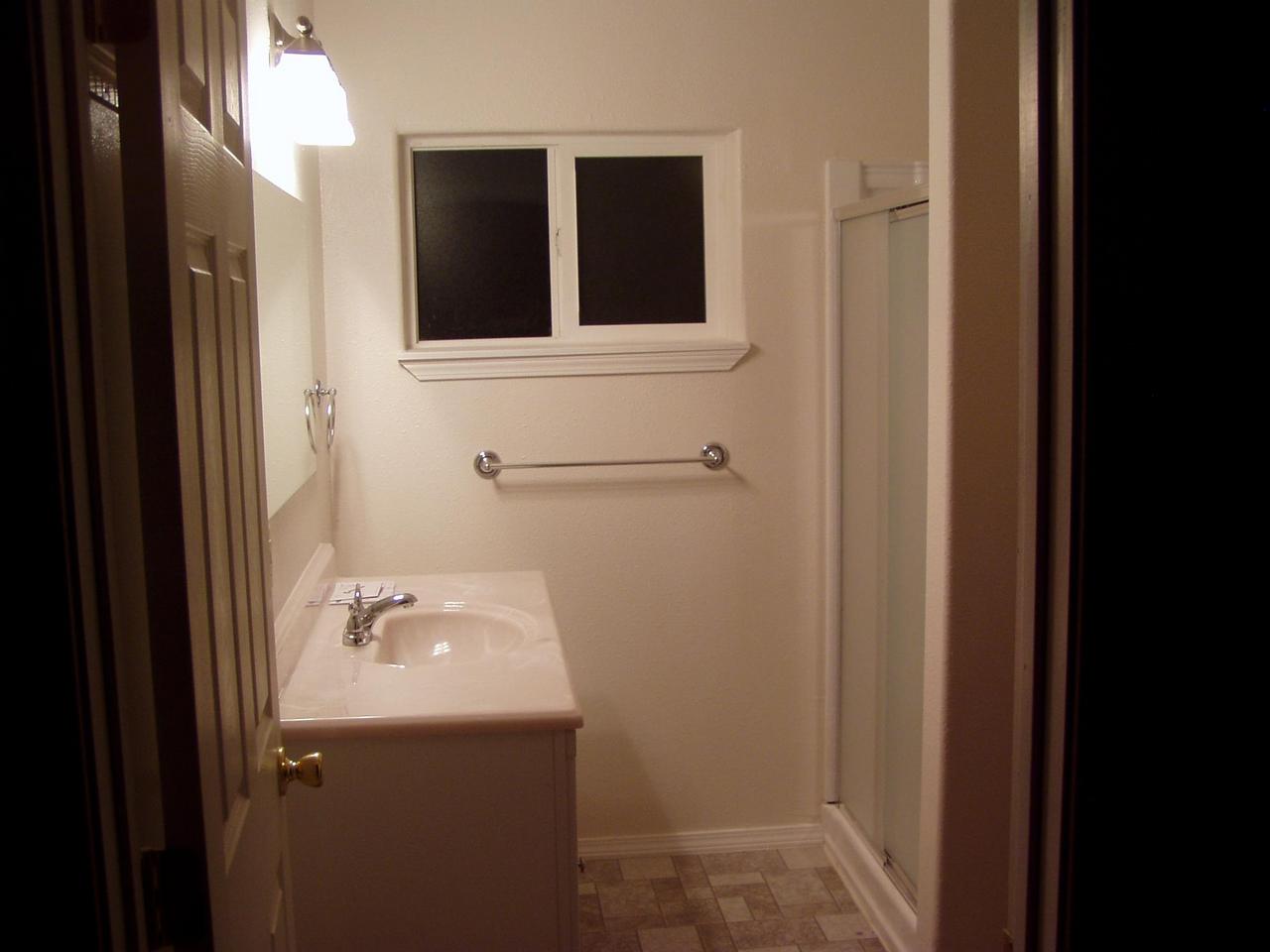 341 Liberty Road Granger, WA 98932 - Photo 11 of 19 a bathroom with a sink and mirror