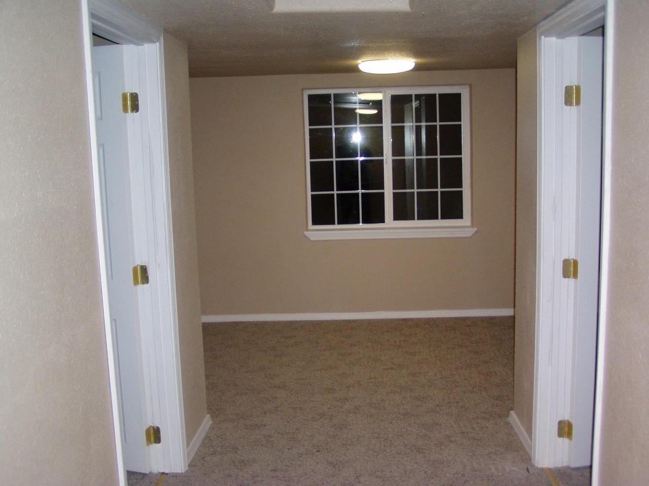 341 Liberty Road Granger, WA 98932 - Photo 12 of 19 a view of an empty room with a window