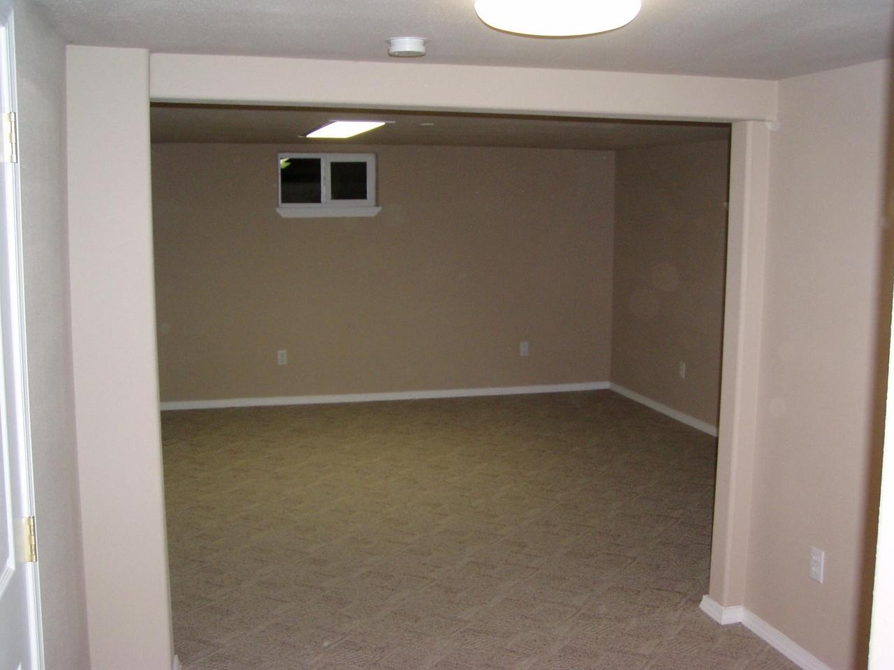 341 Liberty Road Granger, WA 98932 - Photo 15 of 19 a view of empty room with wooden floor