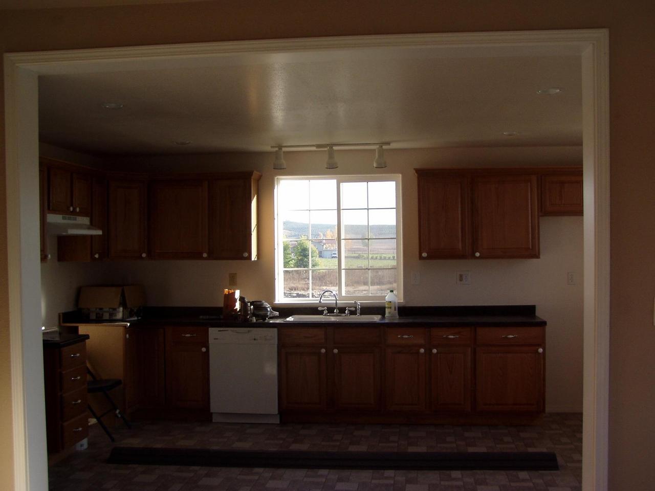 341 Liberty Road Granger, WA 98932 - Photo 3 of 19 a kitchen with a sink and cabinets