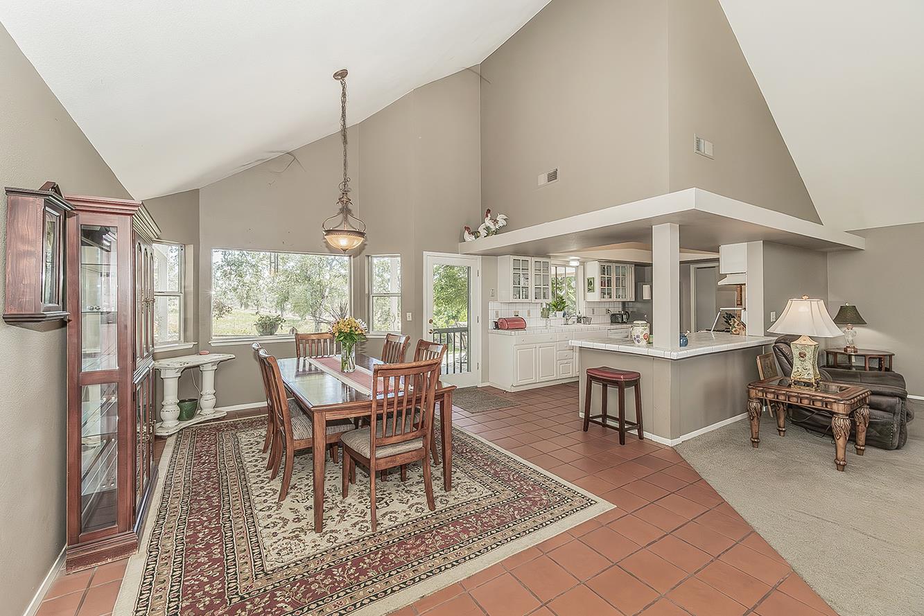 14815 Garlock Lane Prather, CA 93651 - Photo 13 of 80 a dining room with wooden floor and large window