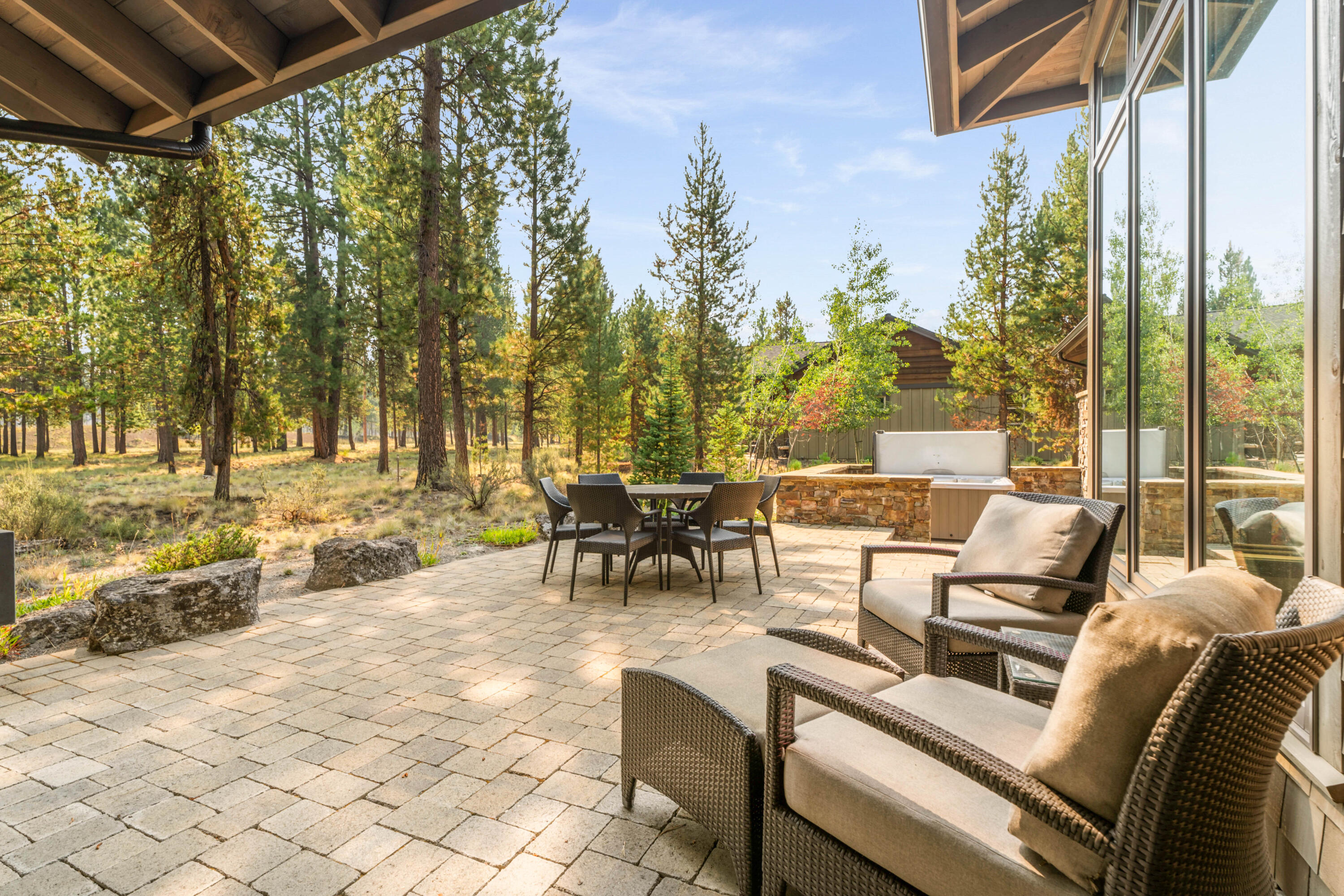 56641 Sunstone Loop, Unit 135 Bend, OR 97707 - Photo 48 of 62 Enjoy exceptional outdoor living on the expansive patio w/ a fountain, built-in BBQ, outdoor heater & hot tub.