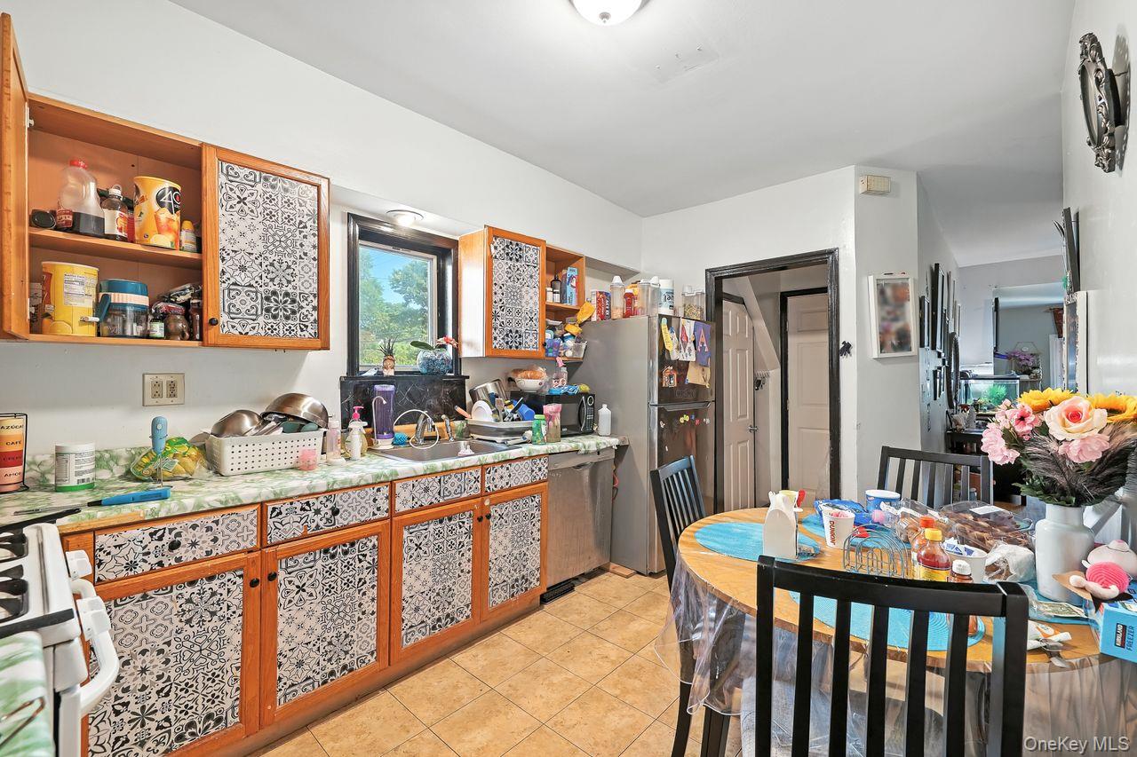 5 Dillon Road Larchmont, NY 10538 - Photo 11 of 36 a kitchen that has a lot of cabinets a sink and a wooden floor