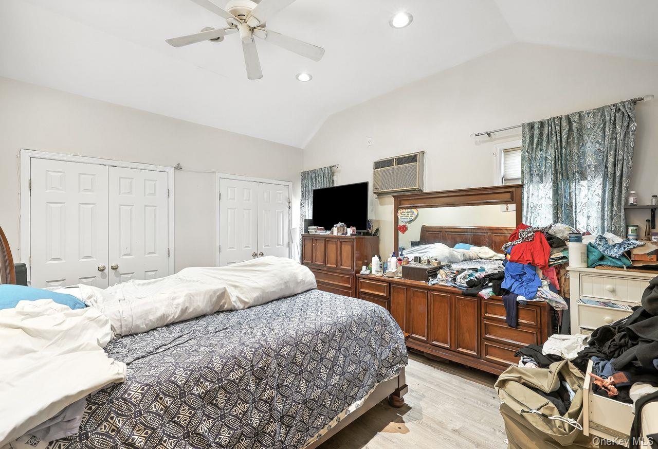 5 Dillon Road Larchmont, NY 10538 - Photo 15 of 36 a bedroom with a bed window and flat screen tv