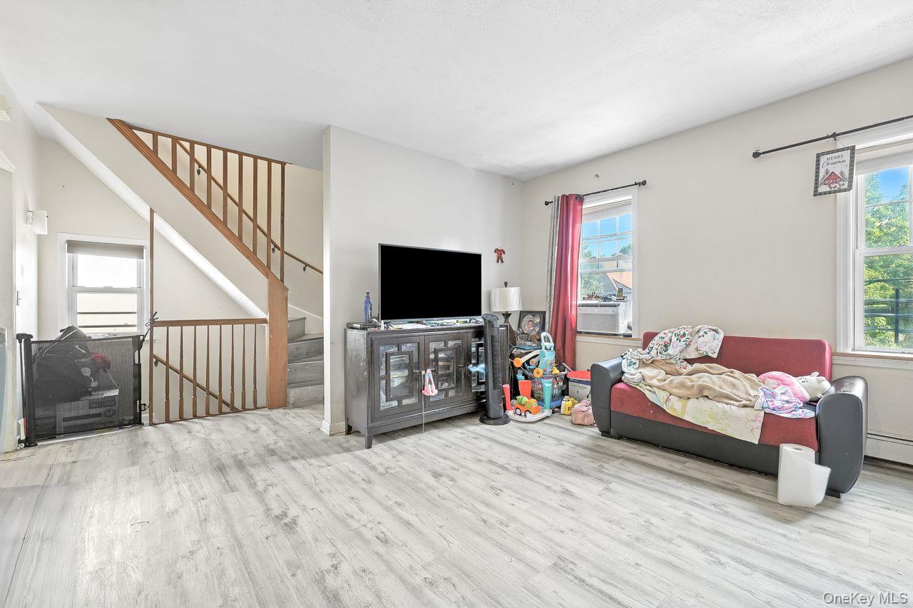 5 Dillon Road Larchmont, NY 10538 - Photo 20 of 36 a bedroom with furniture and a flat screen tv