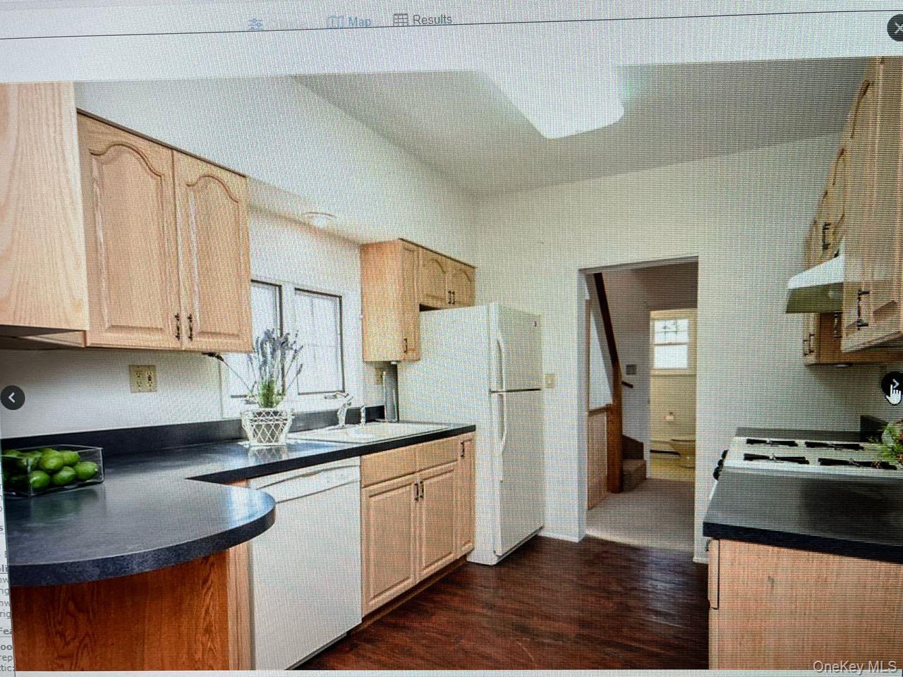 5 Dillon Road Larchmont, NY 10538 - Photo 21 of 36 a kitchen with stainless steel appliances granite countertop a sink stove refrigerator and cabinets