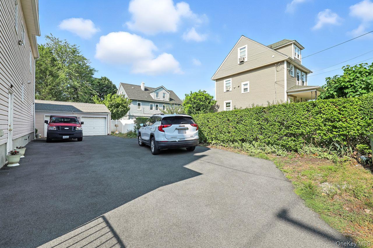 5 Dillon Road Larchmont, NY 10538 - Photo 29 of 36 a view of a car parked in front of a house