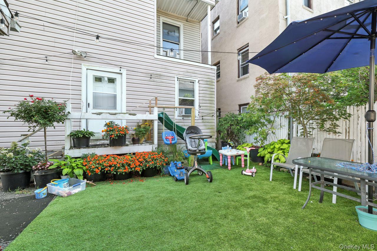 5 Dillon Road Larchmont, NY 10538 - Photo 34 of 36 a view of a chair and table in backyard of the house
