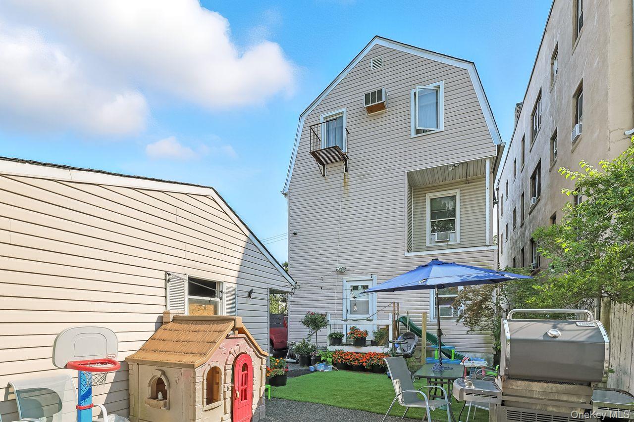 5 Dillon Road Larchmont, NY 10538 - Photo 35 of 36 a view of a house with a yard and furniture