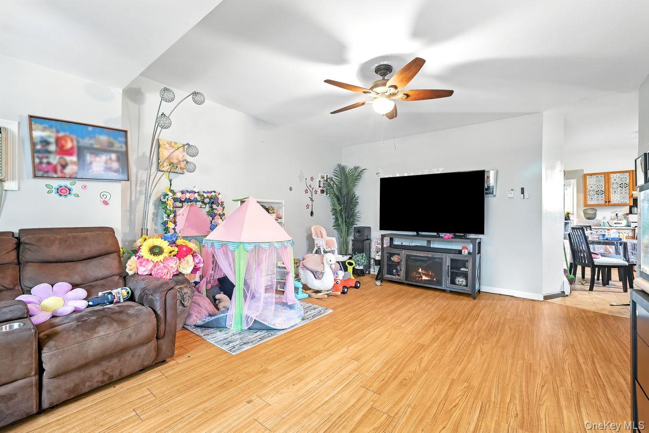 5 Dillon Road Larchmont, NY 10538 - Photo 5 of 36 a living room with furniture and a flat screen tv