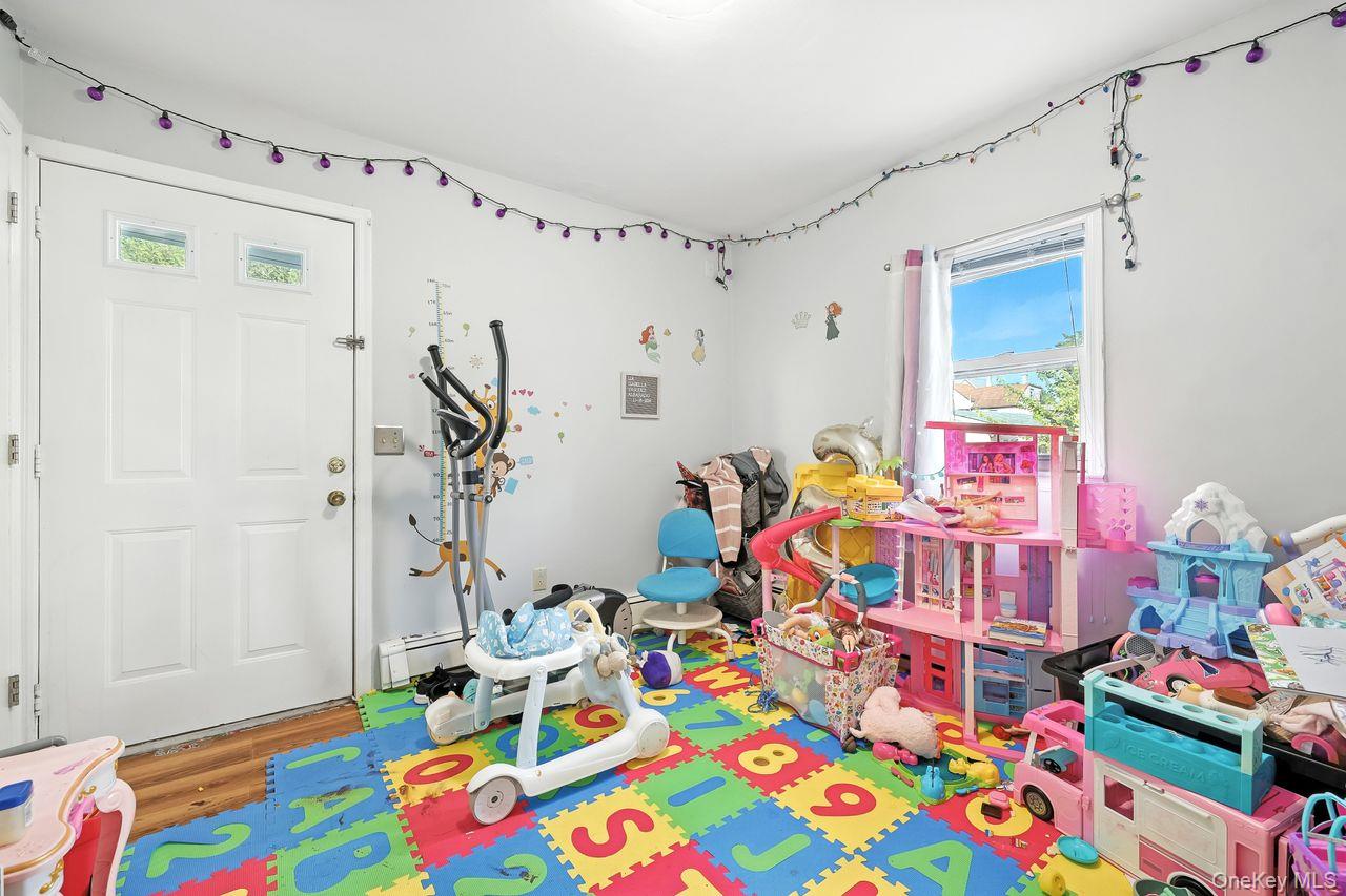 5 Dillon Road Larchmont, NY 10538 - Photo 10 of 36 a children room that has a bed and a table in it