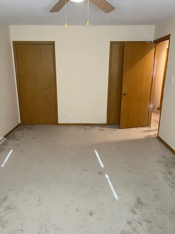 a bathroom with a double vanity sink mirror and toilet