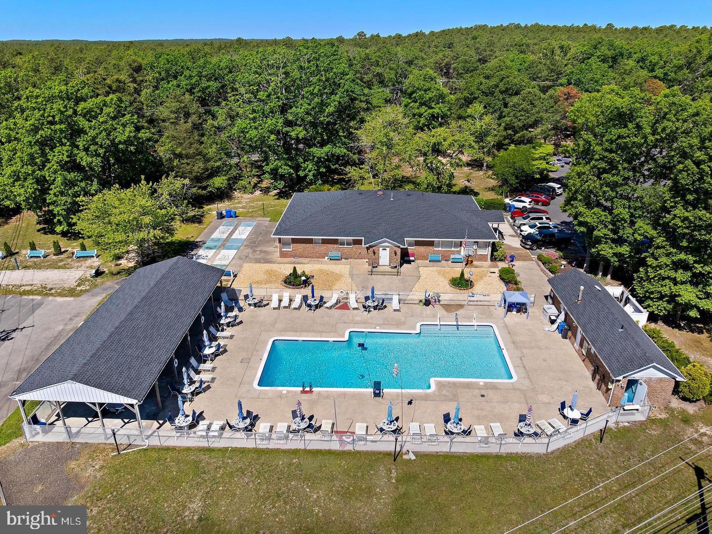 55 Sycamore Access Road Manahawkin, NJ 08050 - Photo 23 of 45 Serene poolside retreat in nature.
