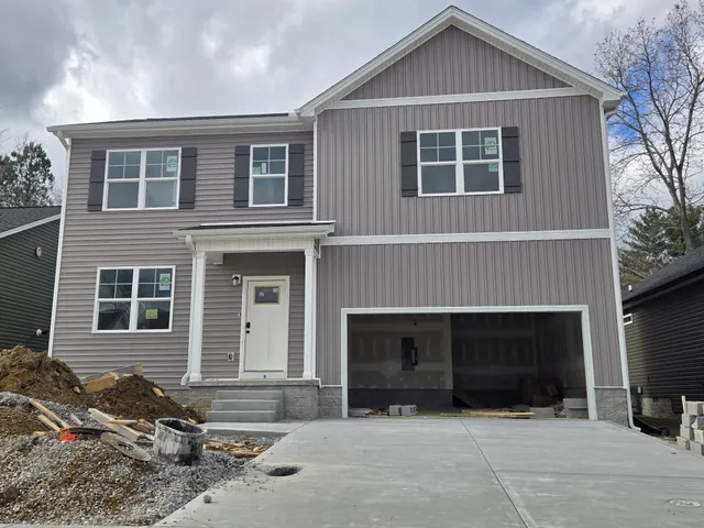 a front view of a house with yard