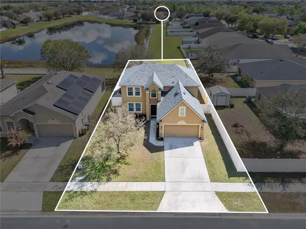 an aerial view of a house with swimming pool