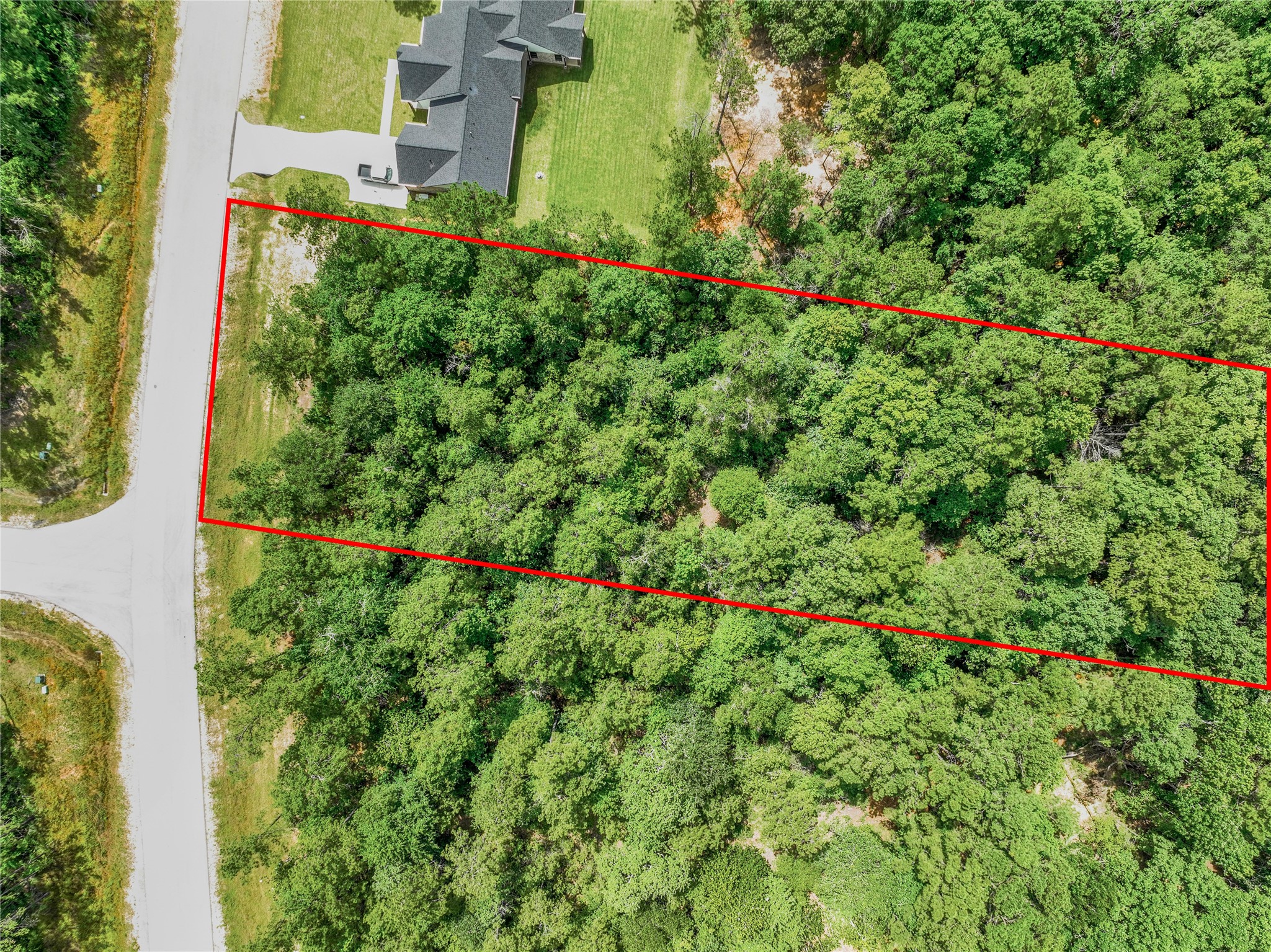 103 Eagle Run Road Willis, TX 77378 - Photo 27 of 35 an aerial view of residential house with outdoor space and trees all around