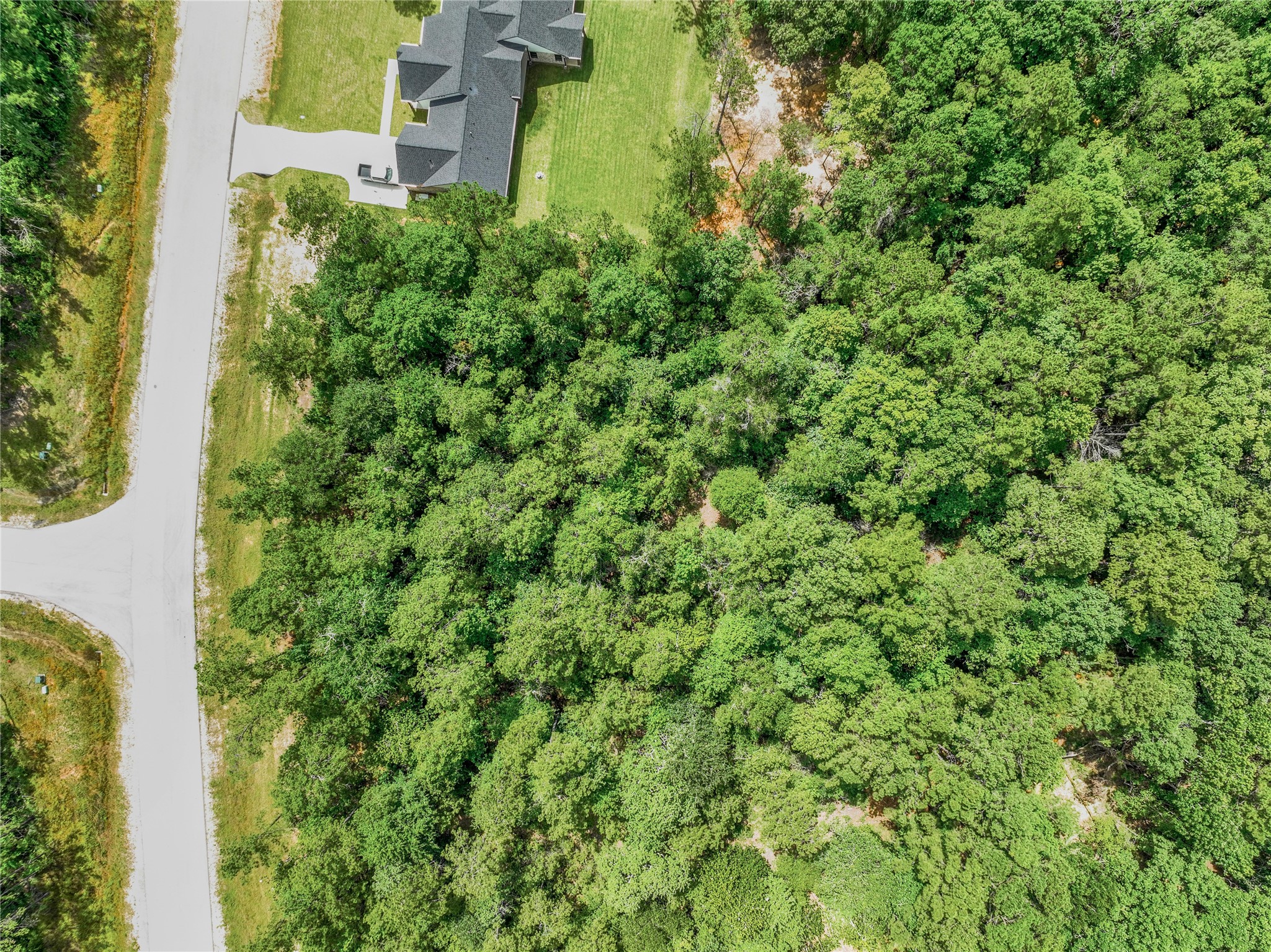 103 Eagle Run Road Willis, TX 77378 - Photo 28 of 35 an aerial view of residential house with outdoor space and trees all around