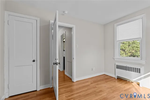 a bathroom with a toilet a sink and a mirror