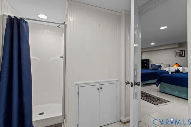 a balcony with wooden floor barbeque oven and outdoor seating