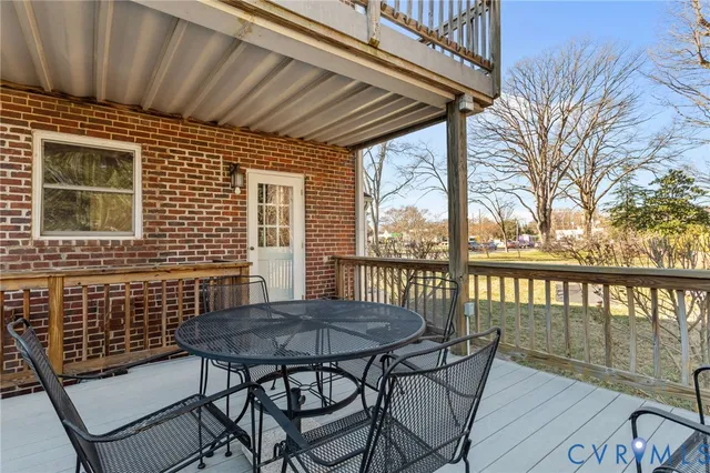 a view of backyard with outdoor seating