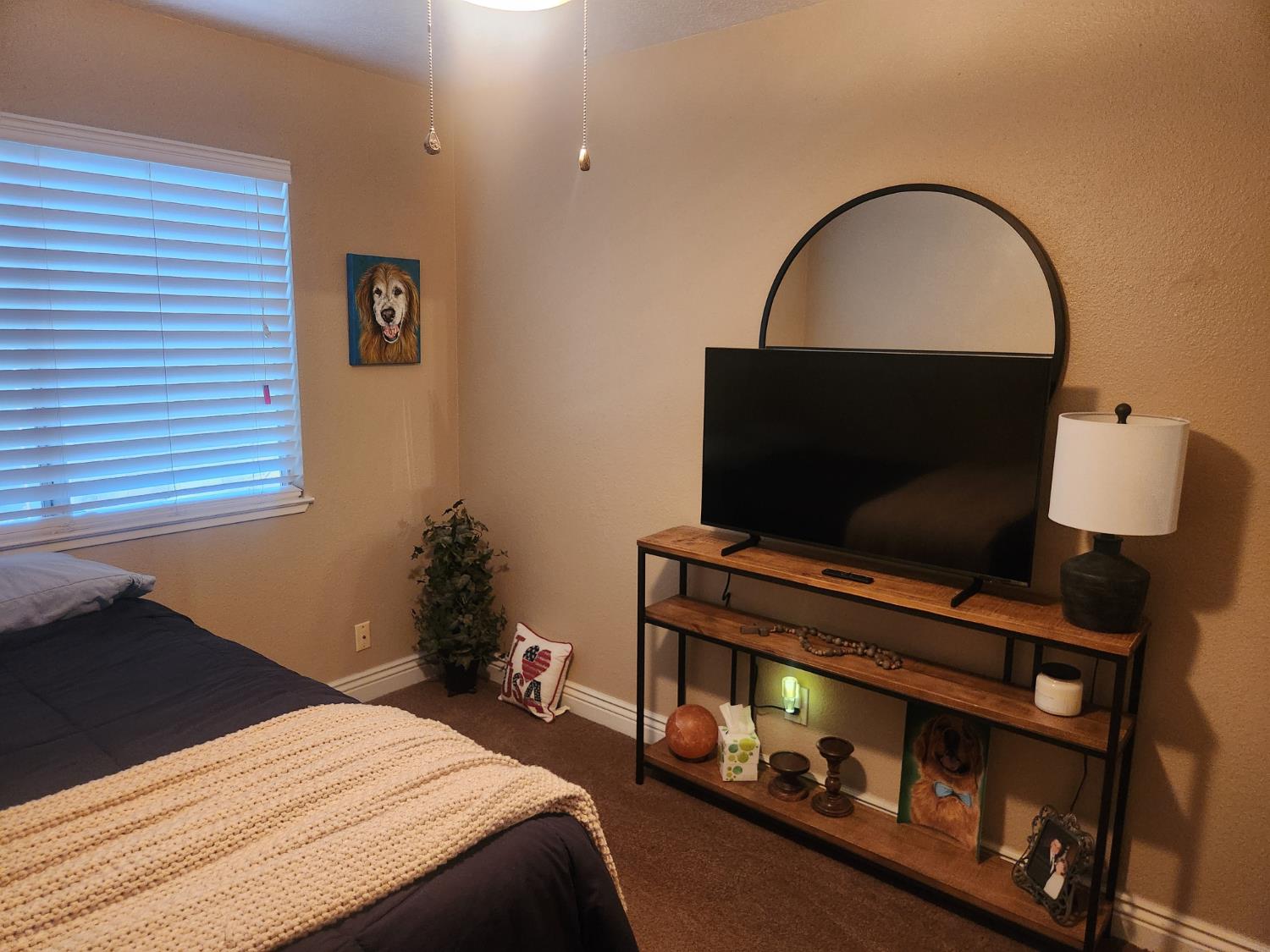 777 Jordanolo Drive Ripon, CA 95366 - Photo 36 of 61 a bedroom with a bed and a flat screen tv