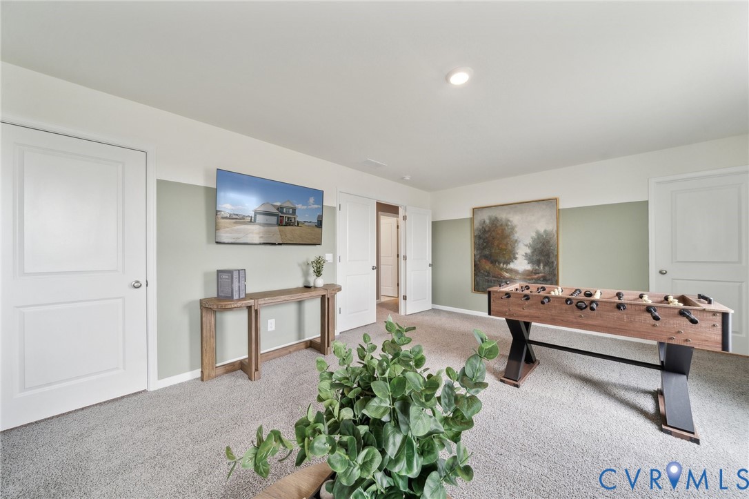 171 Liberty Lane Keswick, VA 22947 - Photo 20 of 25 a living room with furniture and a flat screen tv