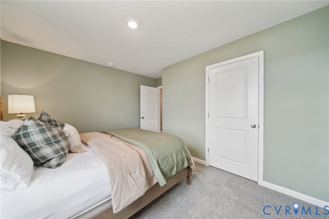 171 Liberty Lane Keswick, VA 22947 - Photo 23 of 25 a bedroom with a bed and a window