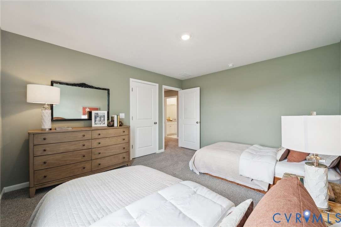 171 Liberty Lane Keswick, VA 22947 - Photo 25 of 25 a bedroom with a bed and a lamp