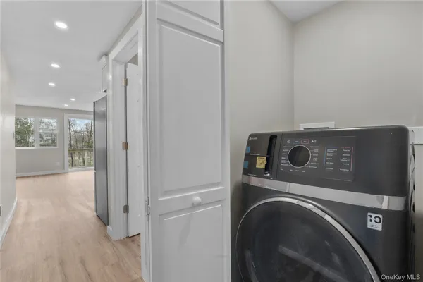 a utility room with dryer and washer