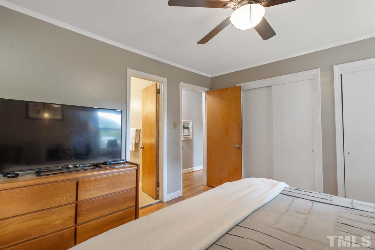 2702 Richwood Road Durham, NC 27705 - Photo 11 of 31 a bedroom with window and flat screen tv