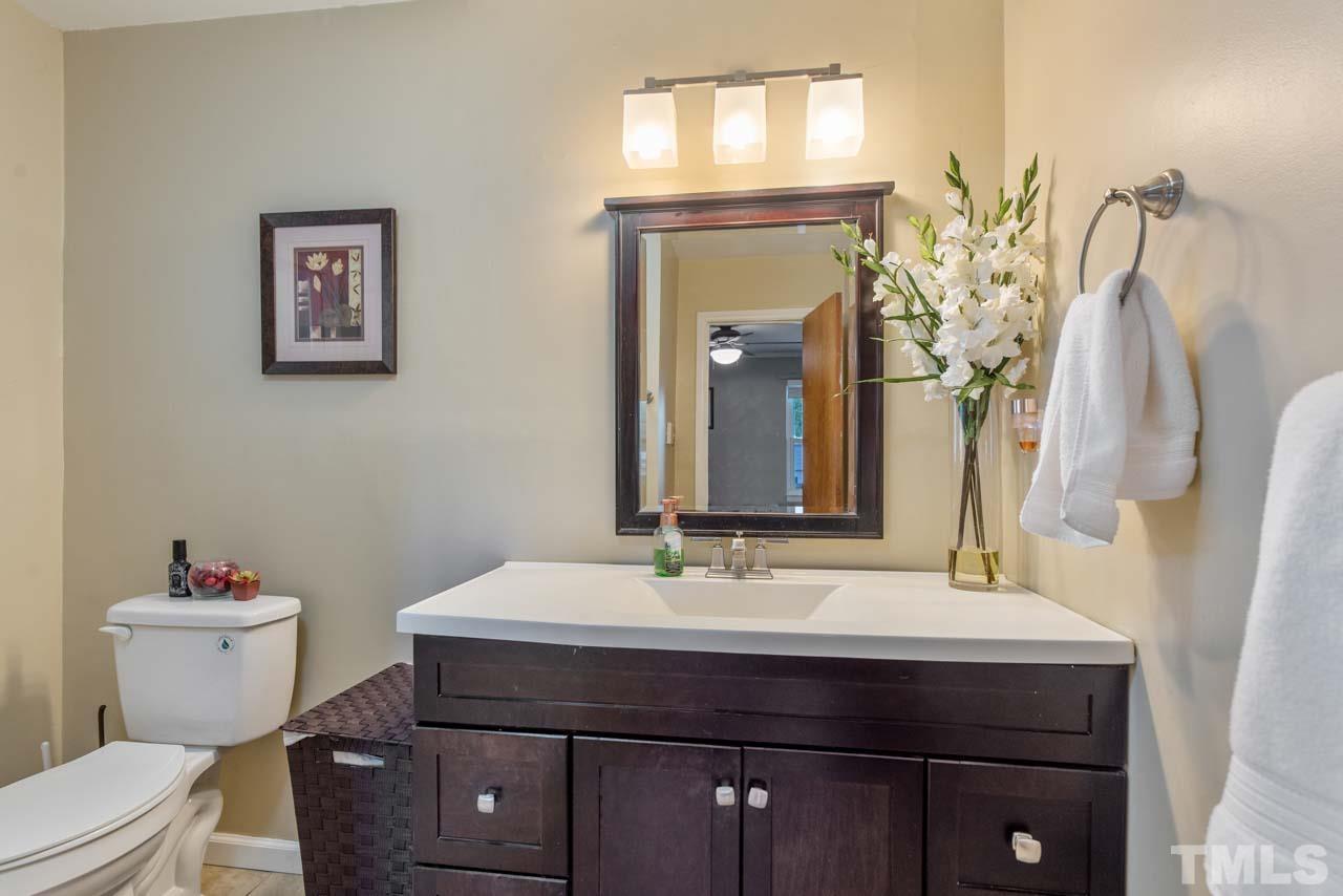 2702 Richwood Road Durham, NC 27705 - Photo 12 of 31 a bathroom with a sink vanity and a toilet