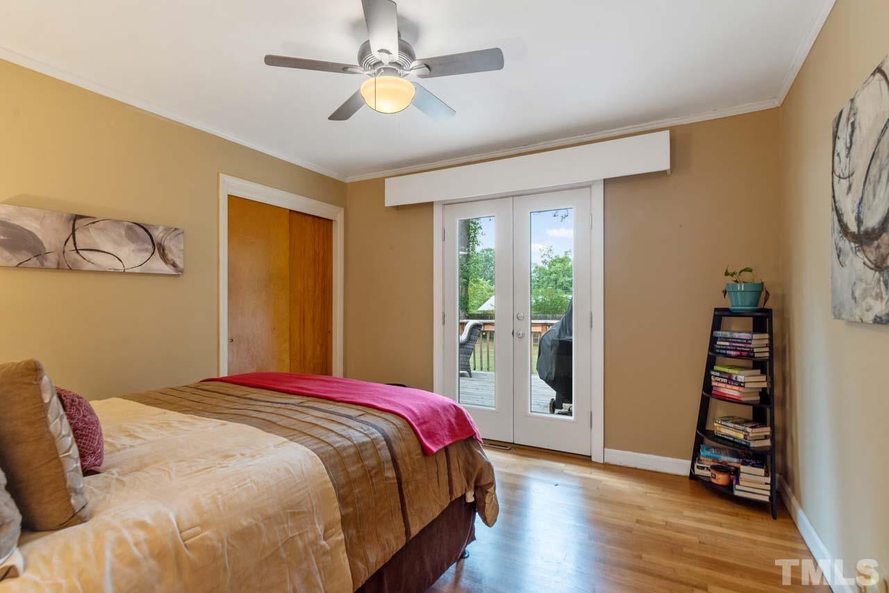 2702 Richwood Road Durham, NC 27705 - Photo 13 of 31 a bedroom with a bed and wooden floor