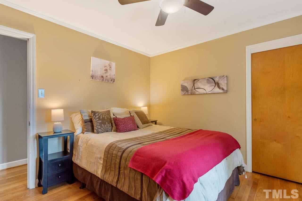 2702 Richwood Road Durham, NC 27705 - Photo 14 of 31 a bedroom with a bed and a painting on the wall