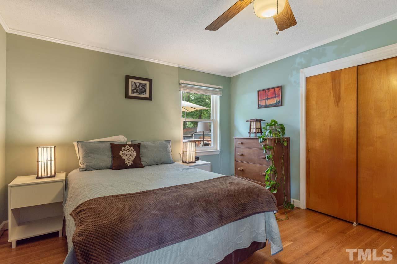 2702 Richwood Road Durham, NC 27705 - Photo 19 of 31 a bedroom with a bed and a window