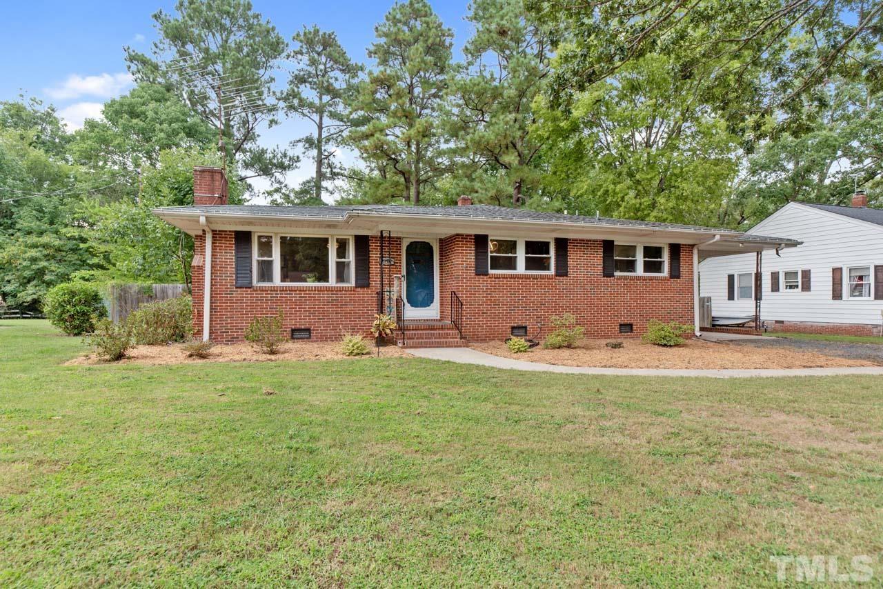 2702 Richwood Road Durham, NC 27705 - Photo 26 of 31 a view of a house with a backyard